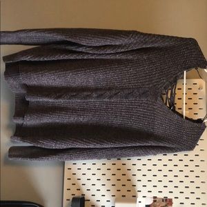 Grey sweater with cute tie up in the back.